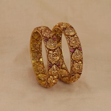 125VG2555-125VG2556 | 22Kt Gold Antique Nakshi Bangles With Lakshmi Devi And Peacock Motifs 125VG2555
