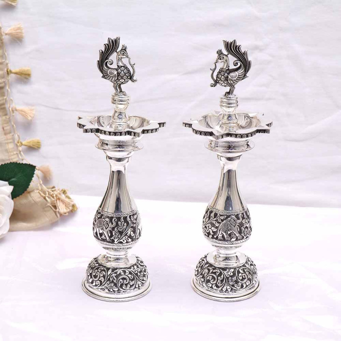 Buy Vaibhav Jewellers Antique Silver Embossed Five Nose Peacock Diya ...