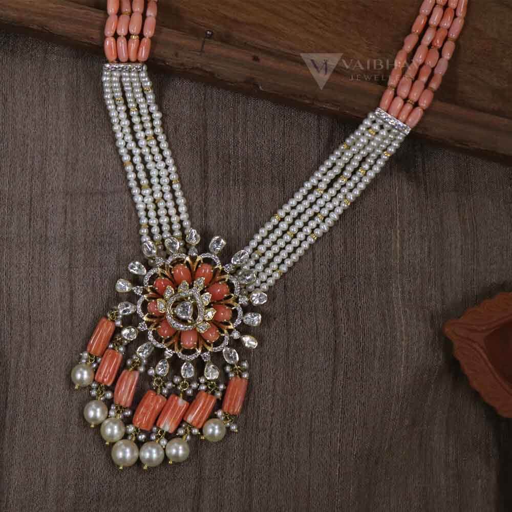 Diamond necklace with coral beads and emeralds - Indian Jewellery Designs